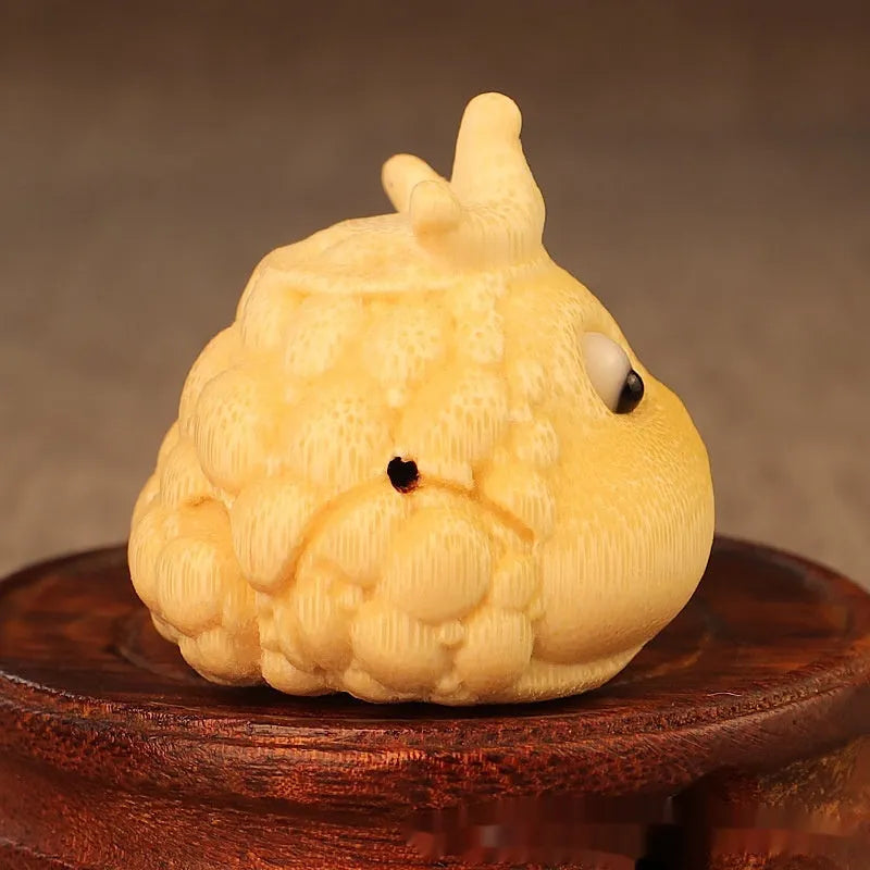 Hand-carved bamboo sculpture of a cute Crown Princess toad ornament.
