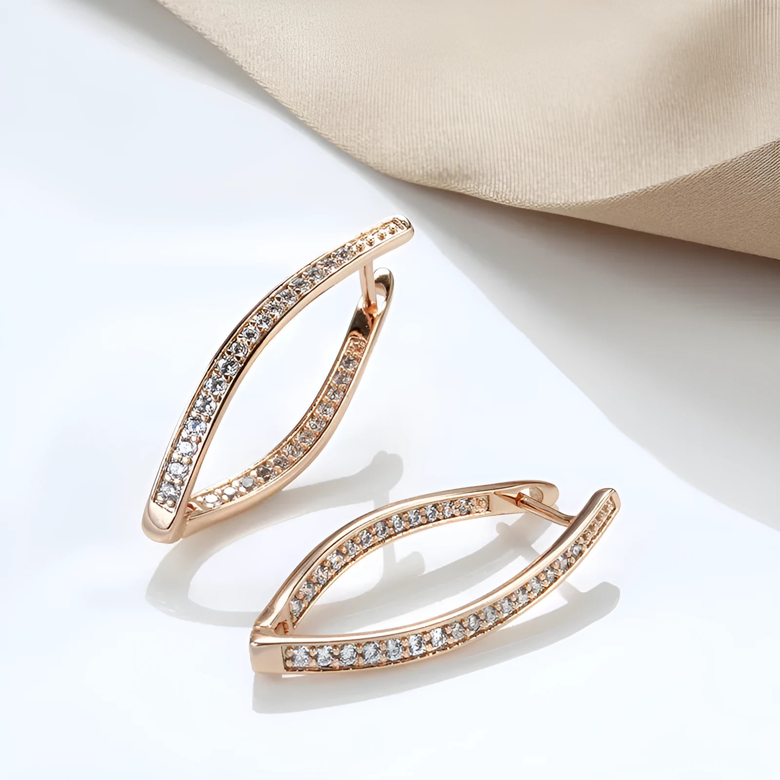Geometric-shaped copper drop earrings for women with zircon stones, shown as a pair.