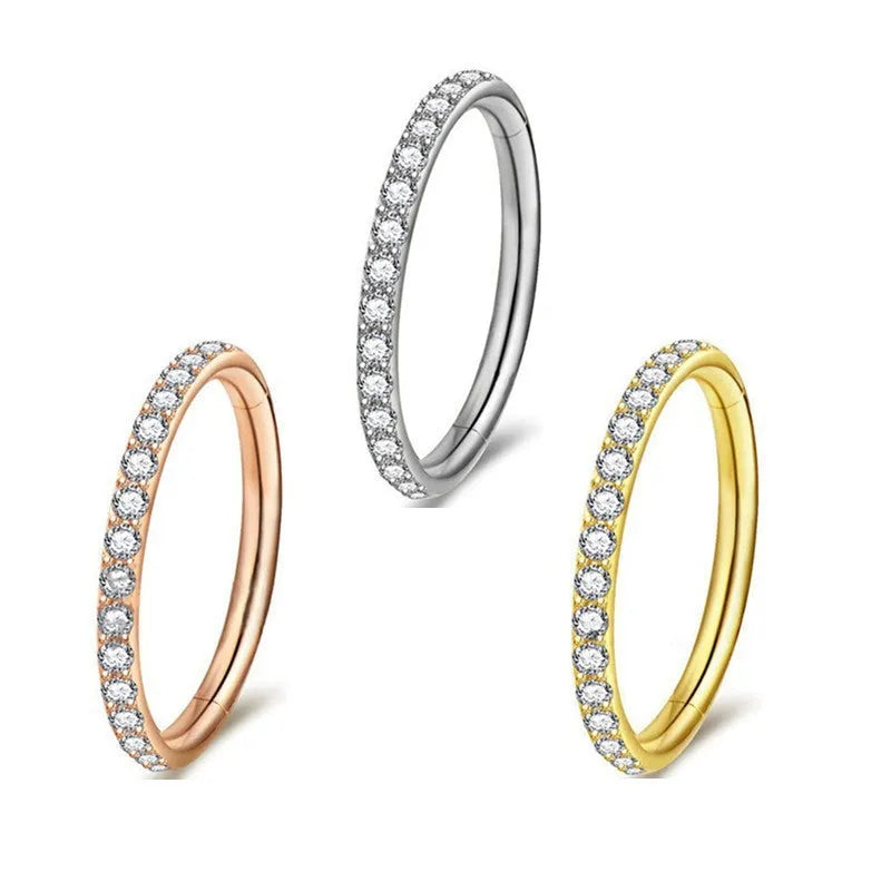 Stainless steel seamless nose ring in round shape showing colour options of black, gold, rose gold, and steel.