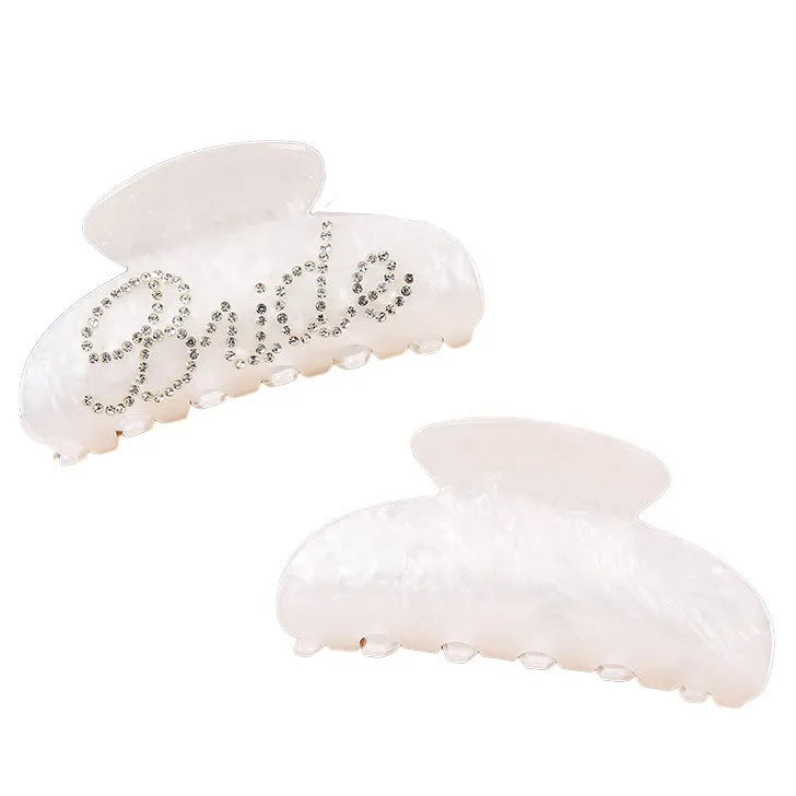 Pink acrylic hair clip with shark shape and diamond spot drilling, 10cm long with spring-clip back.