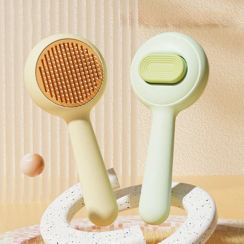 Green and yellow cat grooming brush with removable stainless steel comb and non-slip handle