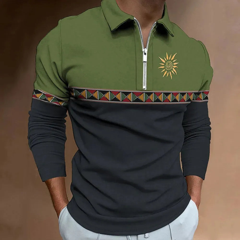 Man wearing a long-sleeved loose-fit striped top with retro colour printing and zipper details.