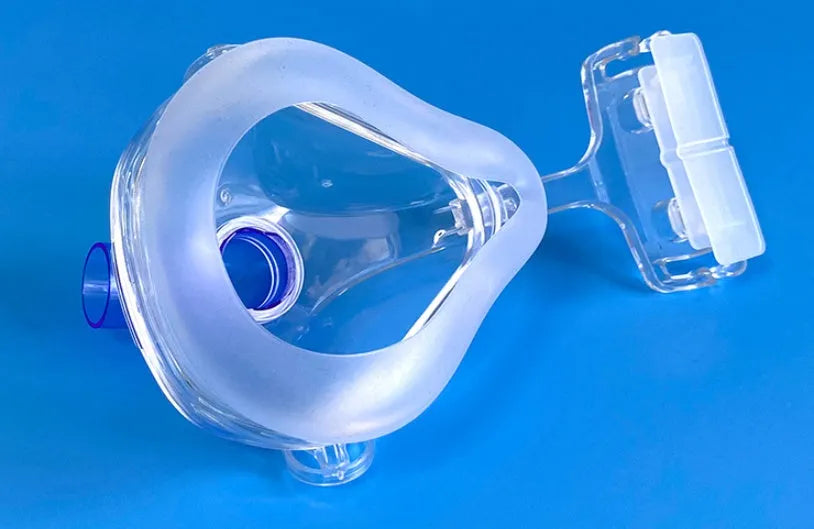 Transparent CPAP breathing mask with silicone construction and rotary elbow adapters for ventilator connection