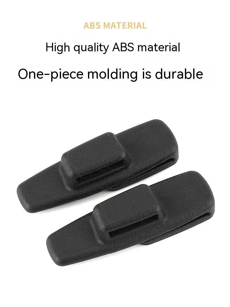 Black ABS plastic car safety belt stopper clip pack containing two universal seat belt fasteners