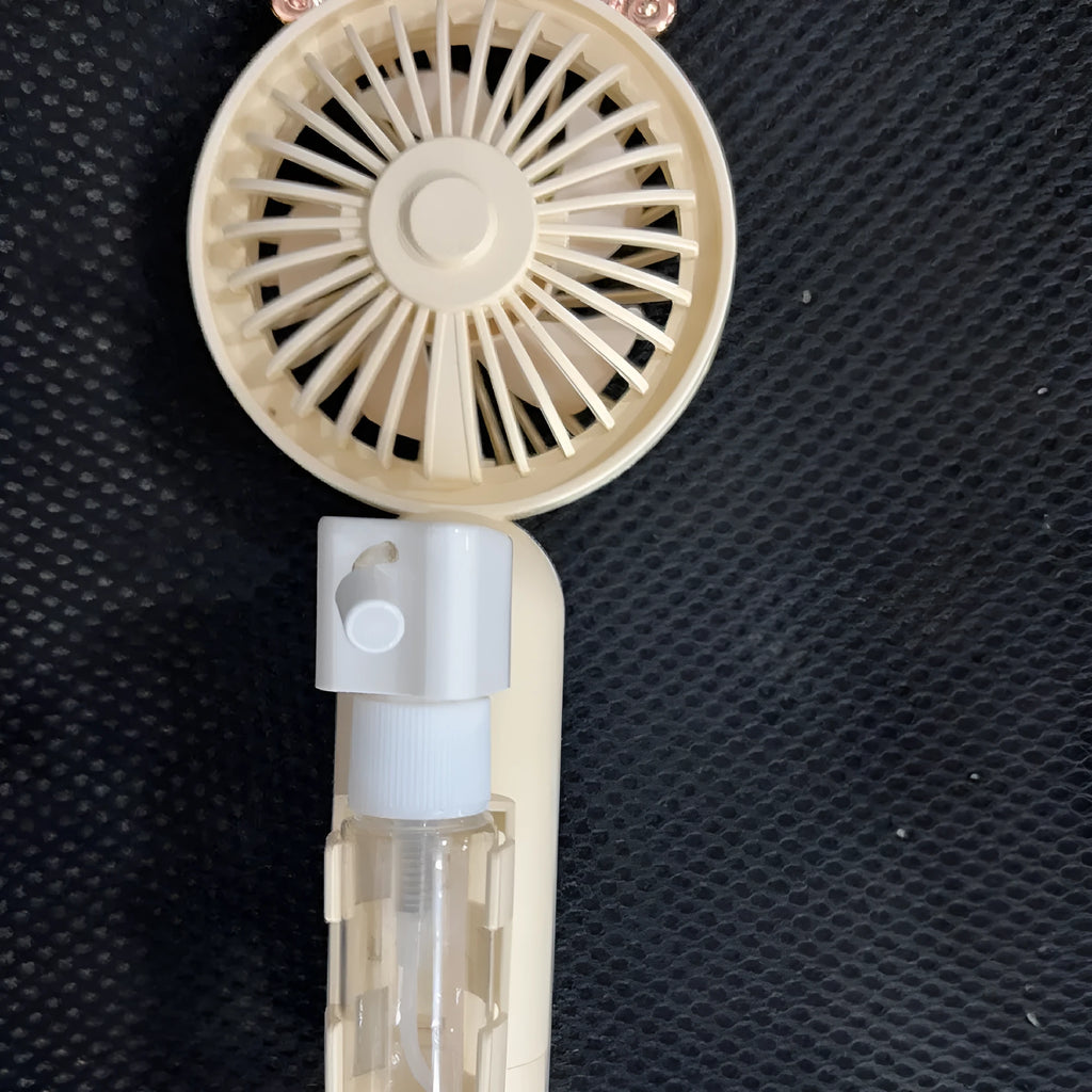 USB rechargeable handheld plastic nozzle fan in apricot, blue, green, orange, and pink colours.