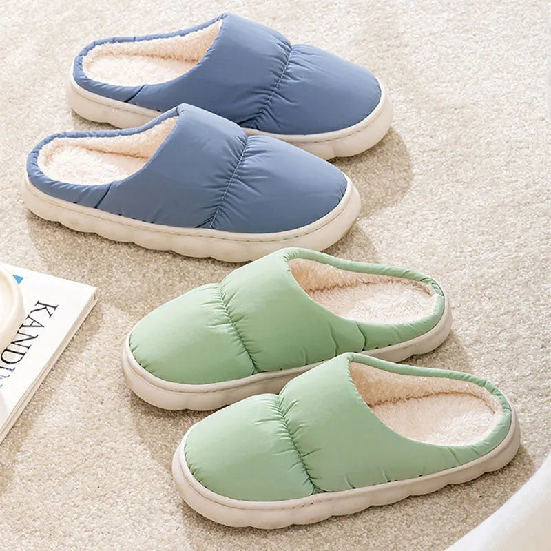 Blue couple's winter slippers with artificial leather upper, plush lining, and thick rubber anti-slip sole.
