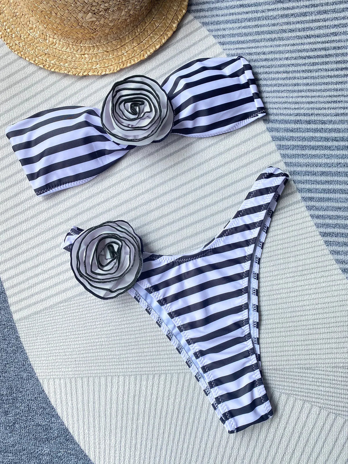 Black cross-back tube top bikini with floral split detail on the shorts.