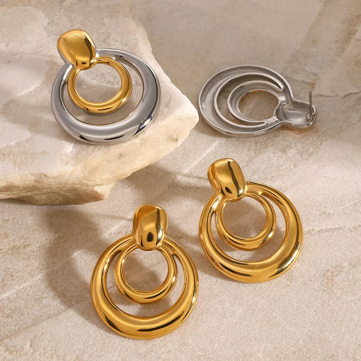 Golden round double-layer hollow stud earrings with geometric design on titanium steel