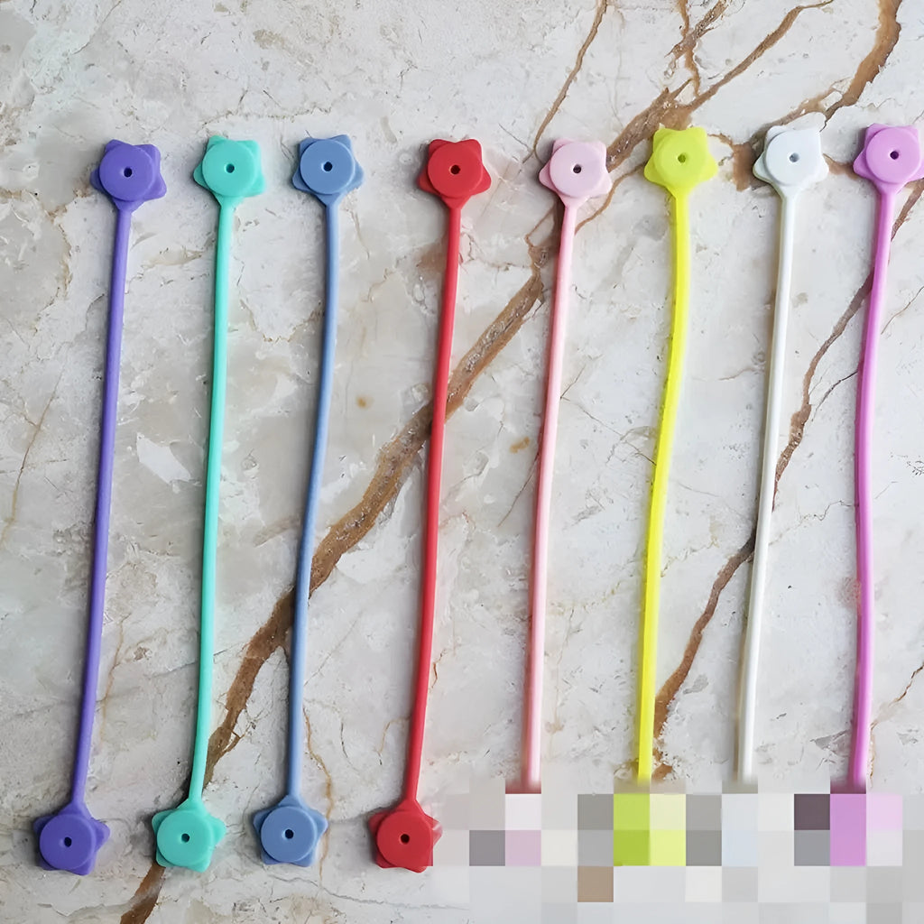Small purple silicone wire winder clip with magnet for organising headphone and phone cables.
