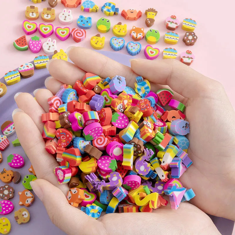 Open pearlescent film bag showing 50 small colourful cartoon fruit-themed rubber erasers.