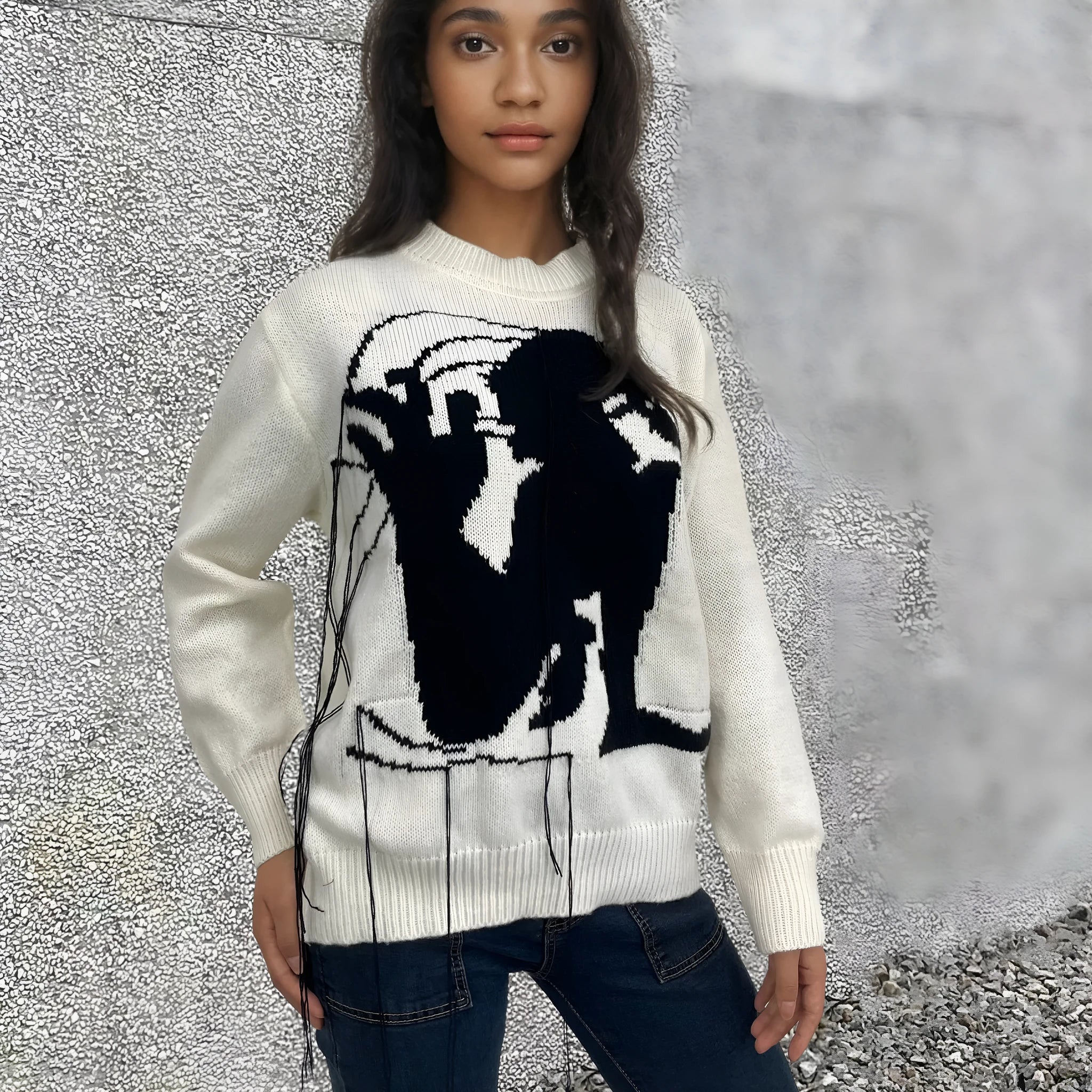 Women's grey alpaca wool sweater with abstract pattern and tassel design on front