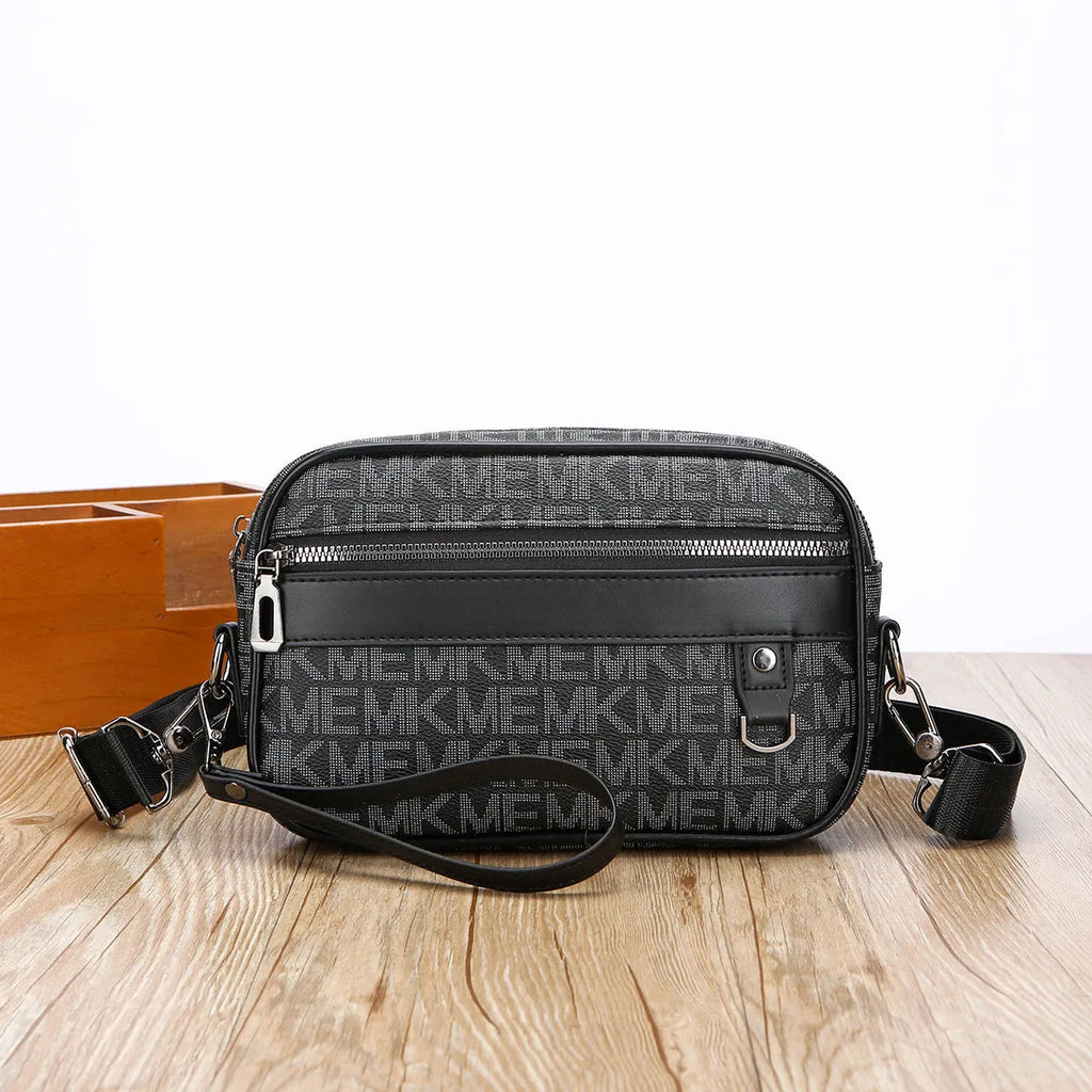 Men's black geometric pattern messenger bag shown in horizontal carrying position with shoulder strap