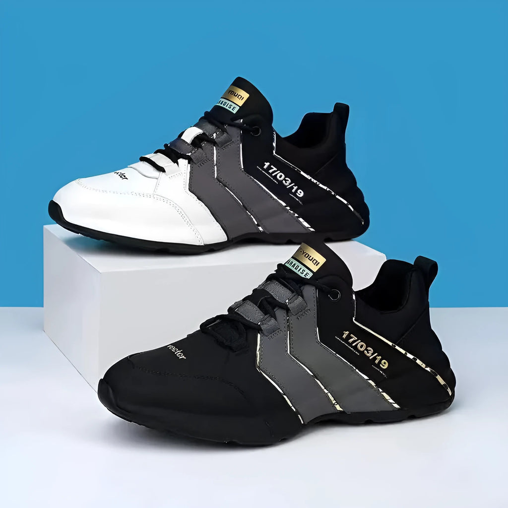 Men's black and grey low-top casual sneakers with thick plastic sole and lace-up front