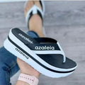 Women's black PU platform slippers showing herringbone toe holder design on a white background.