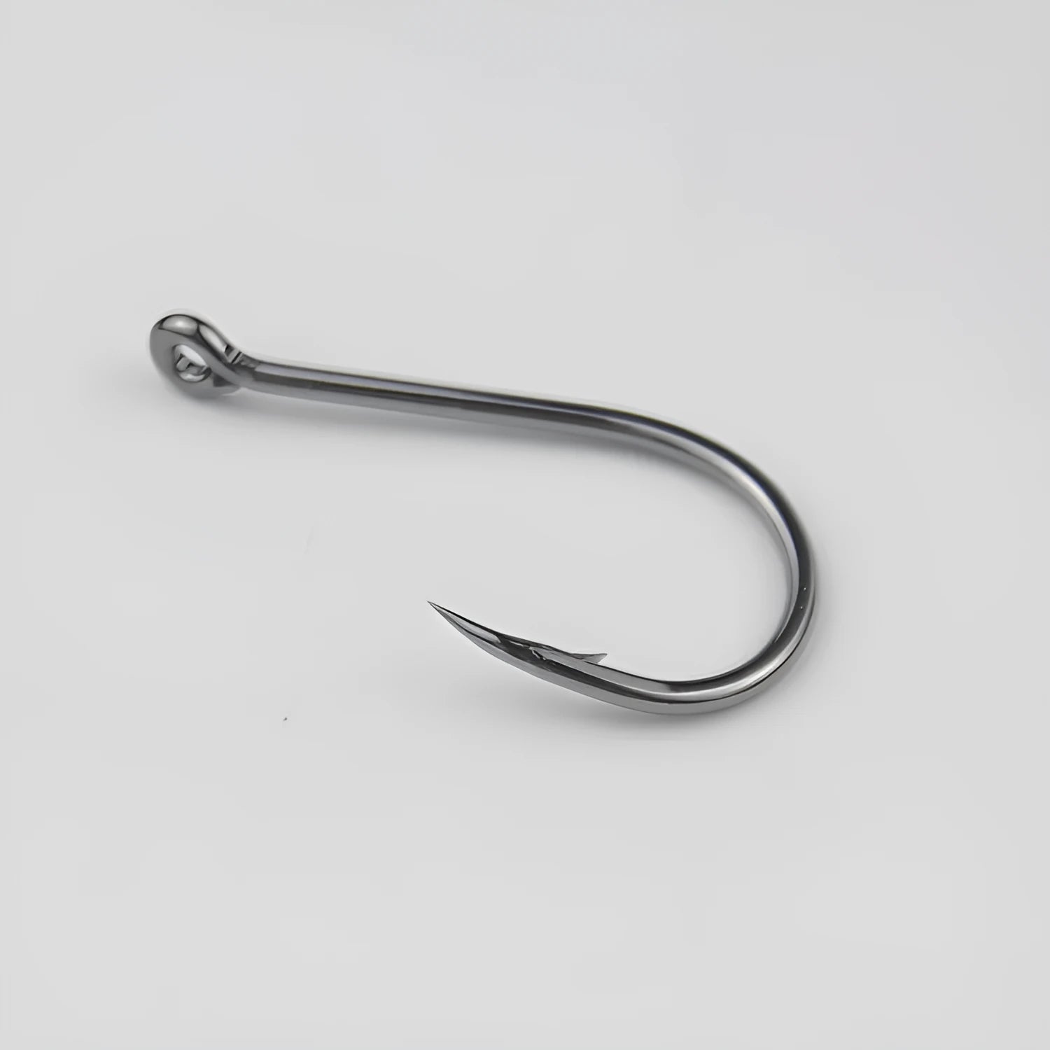 Barbed crooked mouth fishing hooks with hole rings for sea rock fishing, made from alloy carbon steel.