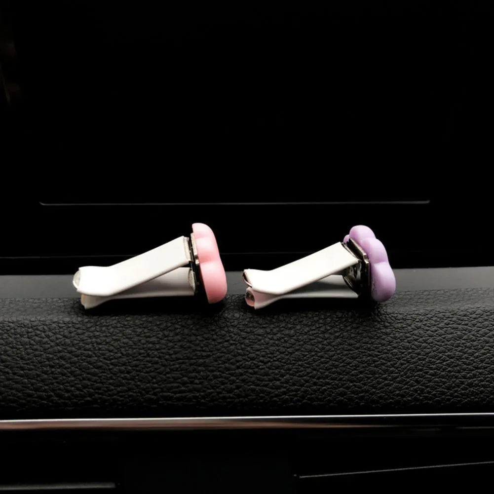 Resin cartoon car fragrance clip in light green colour mounted on car air vent