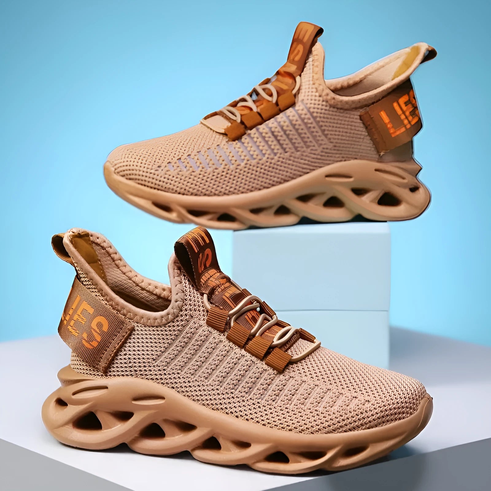 Children's fabric sneakers with Velcro strap in black, khaki, and white colours on a neutral background.