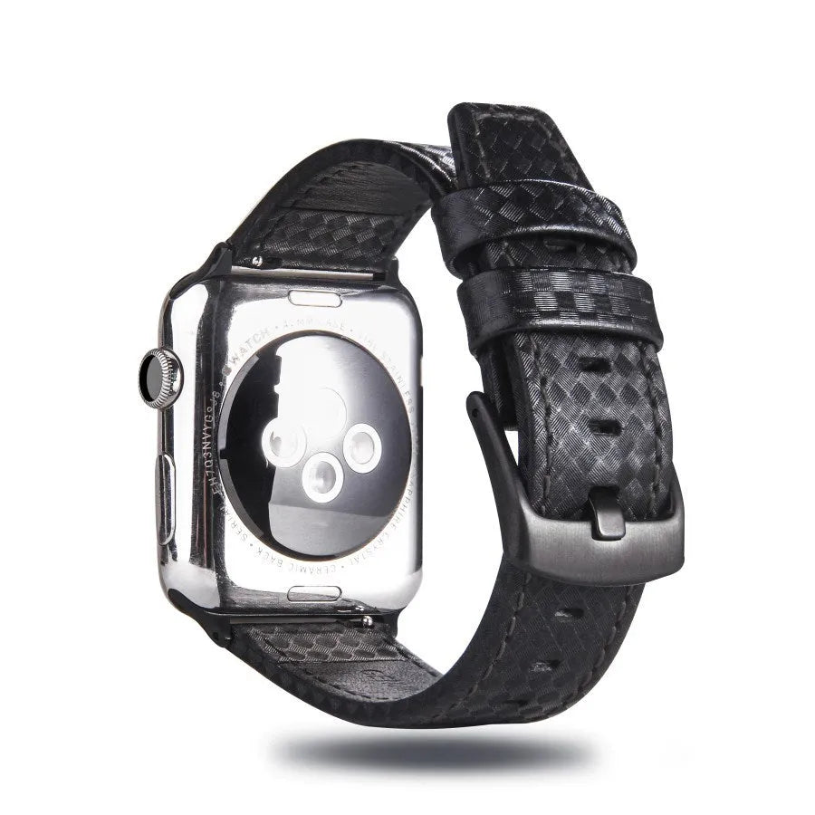 Apple Watch with black leather strap, carbon fibre details, and PC hard shell case with carbon fibre pattern.