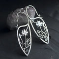 Silver lotus vine design rhinestone earrings with floral geometric pattern
