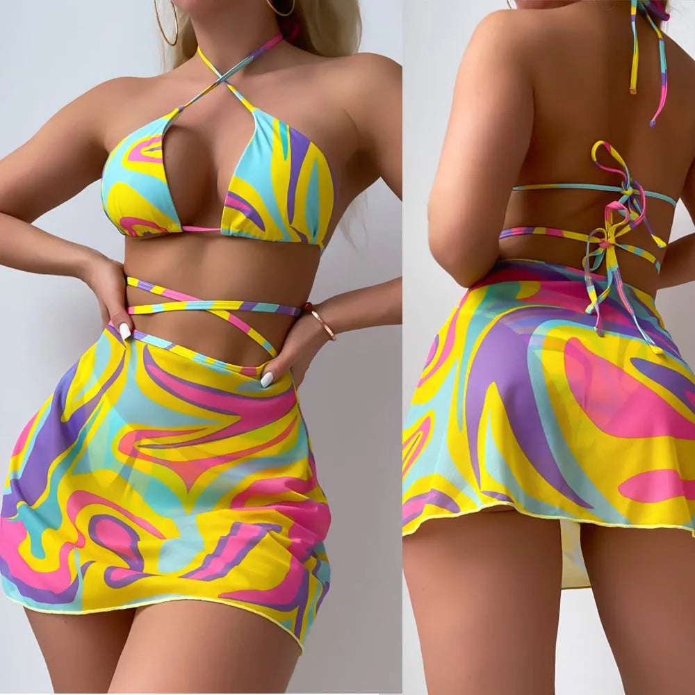 Yellow striped print halter neck swimsuit with lace-up front, includes skirt and shorts