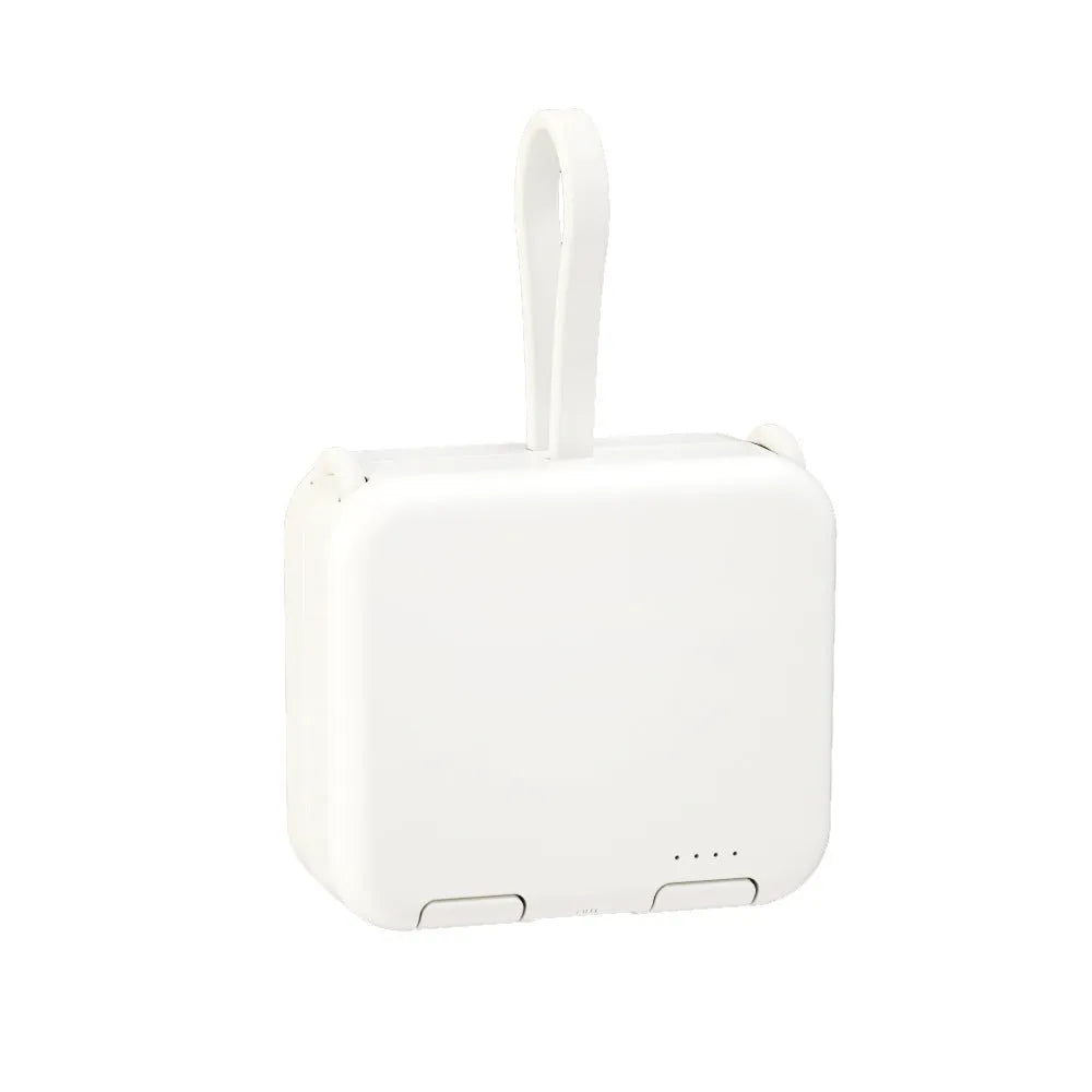 Handbag clip-on power bank in blue showing USB-A and Type-C ports, with phone propped in its integrated stand.