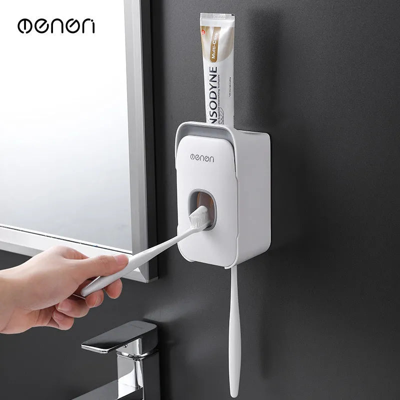Automatic toothpaste dispenser unit mounted on a bathroom wall in blue colour.