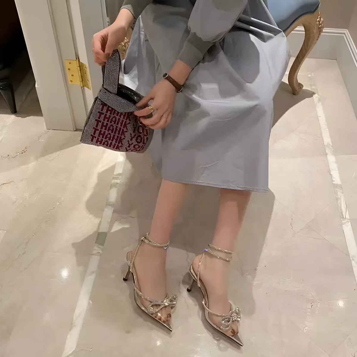Women's black stiletto heel sandals with silk bandage back and buckle fastening, pointed toe.