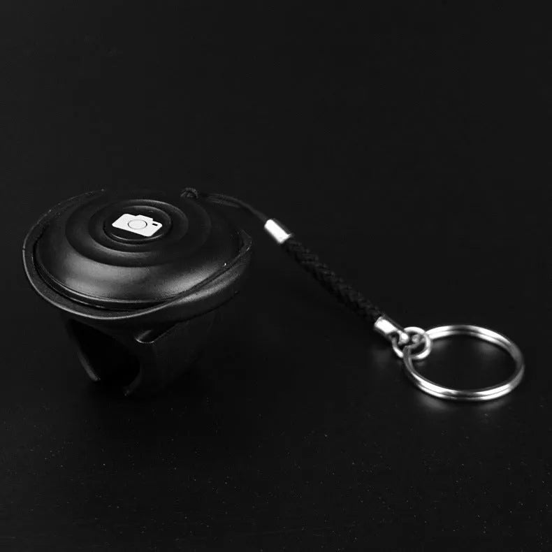 Black Bluetooth selfie remote control for wireless photo snapping over 10 metres away