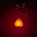 Heart-shaped silicone bike rear light, 15 cm long, touch activated, waterproof, in red blue green.