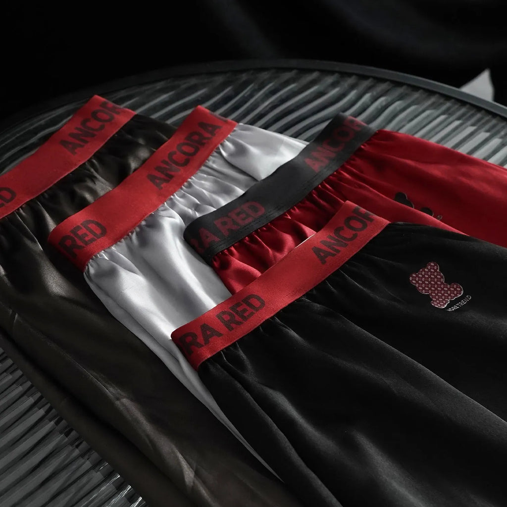 Solid colour men's polyester boxer briefs in six colour options showing mid-waist design