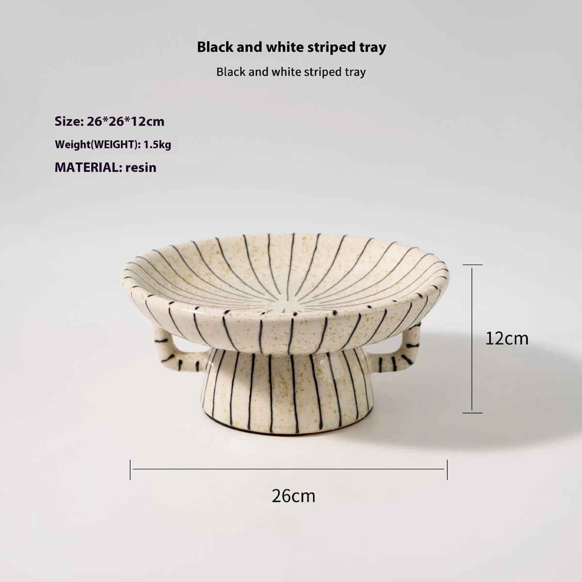 Black and white striped retro synthetic resin dessert plate on a table.