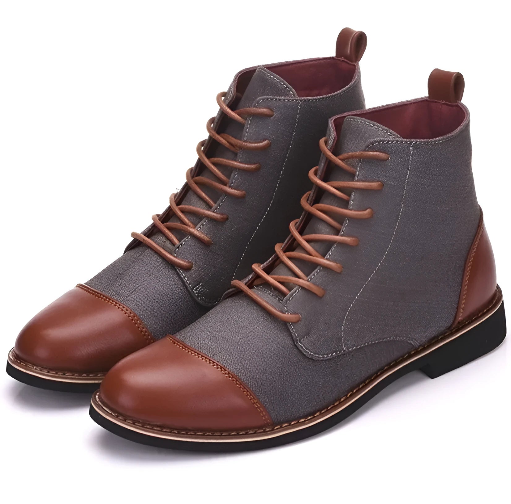 A pair of large black leather motorcycle boots featuring silver buckle details and a thick rubber sole.