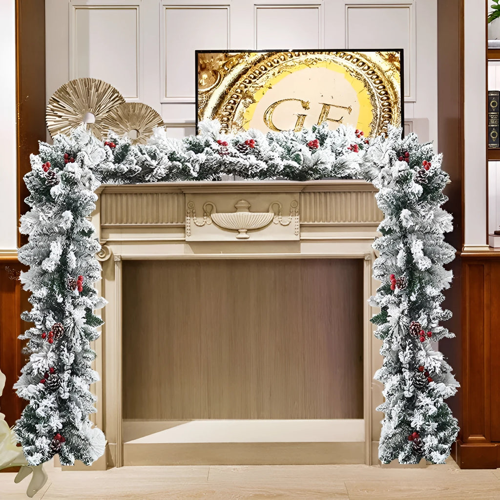 Snow-flocked artificial rattan Christmas garland in green and white on a wooden mantelpiece.