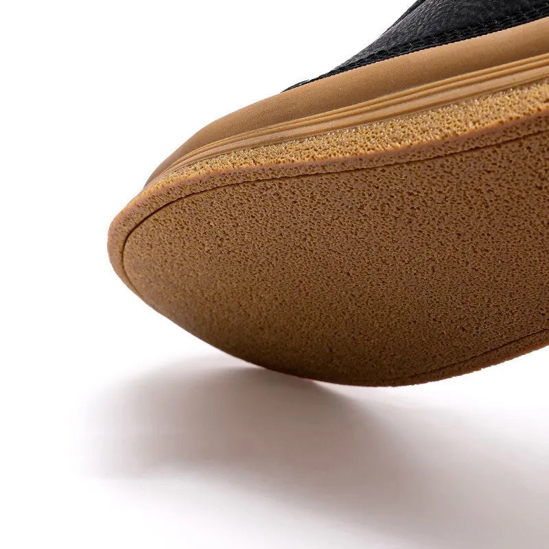 Men's black and white casual leather shoes with round toe, flat heel, and lanyard closure.