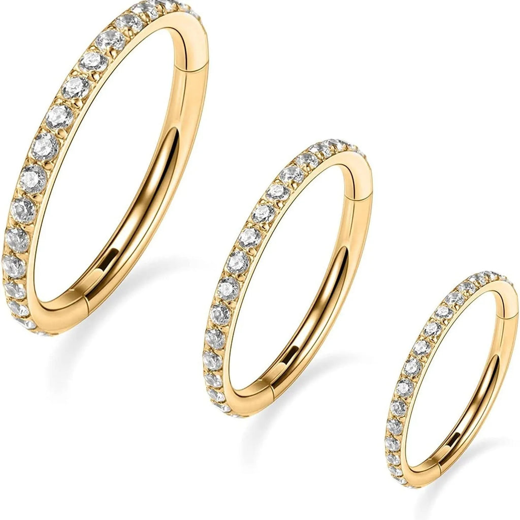 Stainless steel seamless nose ring in round shape showing colour options of black, gold, rose gold, and steel.