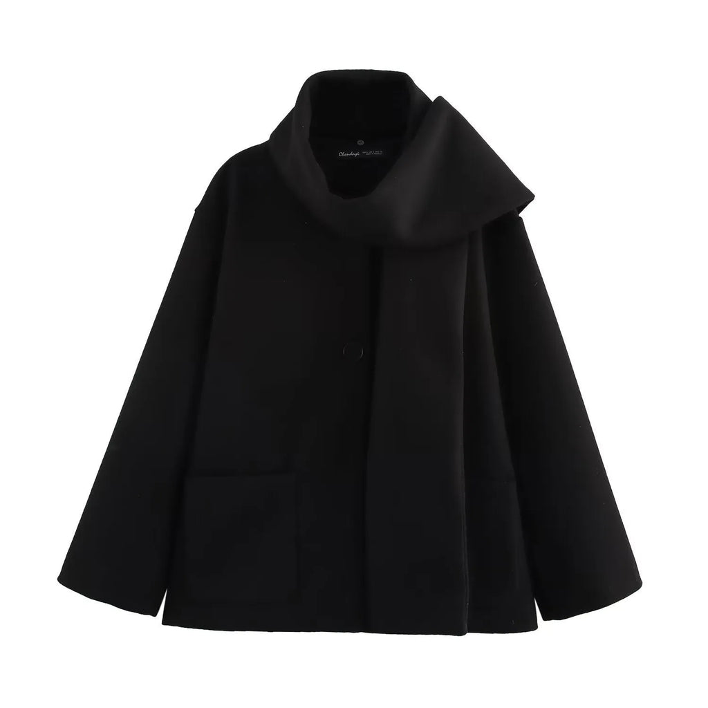 Women's long black polyester coat with a faux fur collar, shown in a street fashion style.