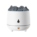 White volcano-shaped ultrasonic humidifier with USB cable on wooden table