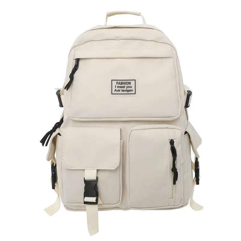 Black and white nylon student backpack with laptop compartment, showing three-dimensional pocket.
