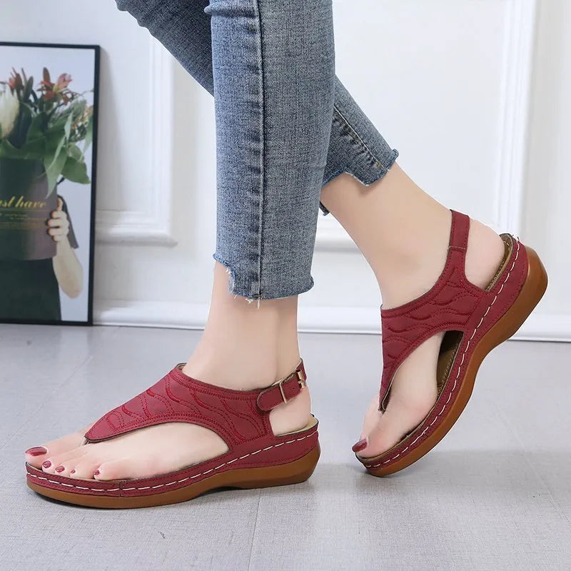 Women's casual wedge-heel sandals with adjustable buckle strap in a solid colour.