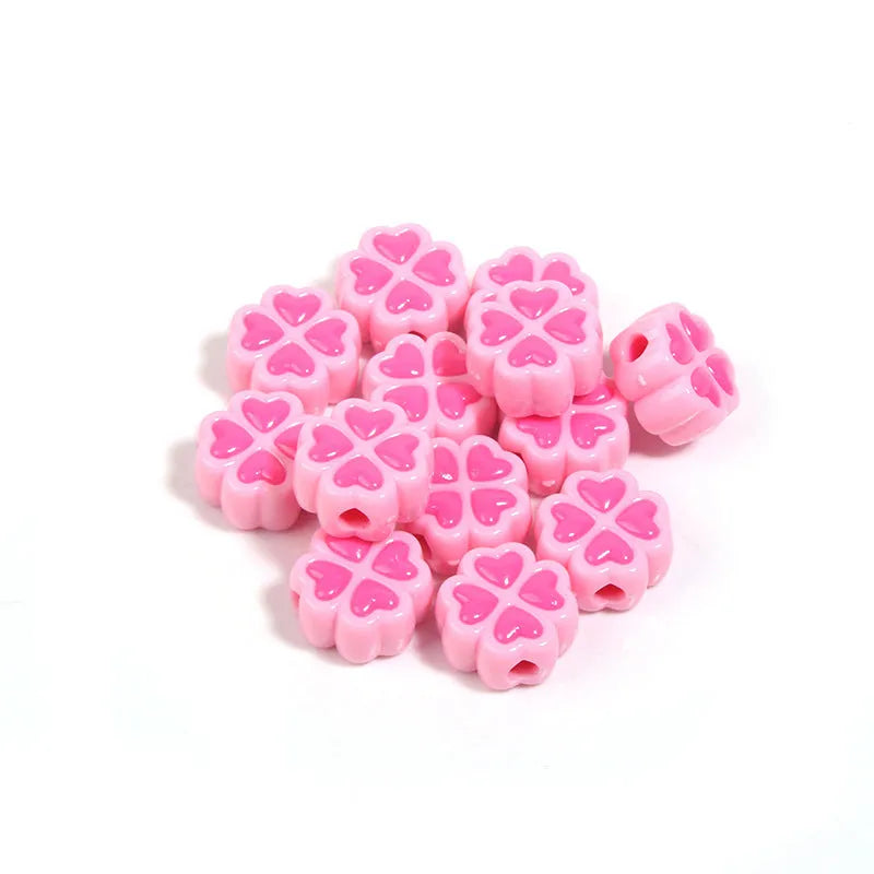 Acrylic clover craft beads with frosted finish in mixed colours including pink, blue and green