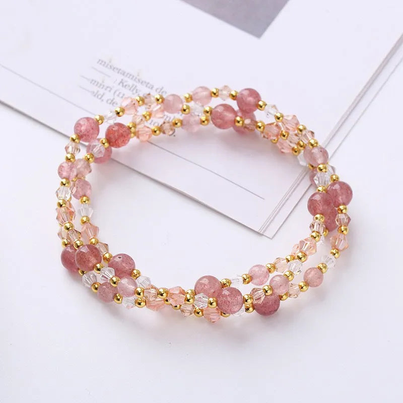 Women's adjustable crystal bracelet with tourmaline, strawberry quartz and amethyst beads on three-ring design