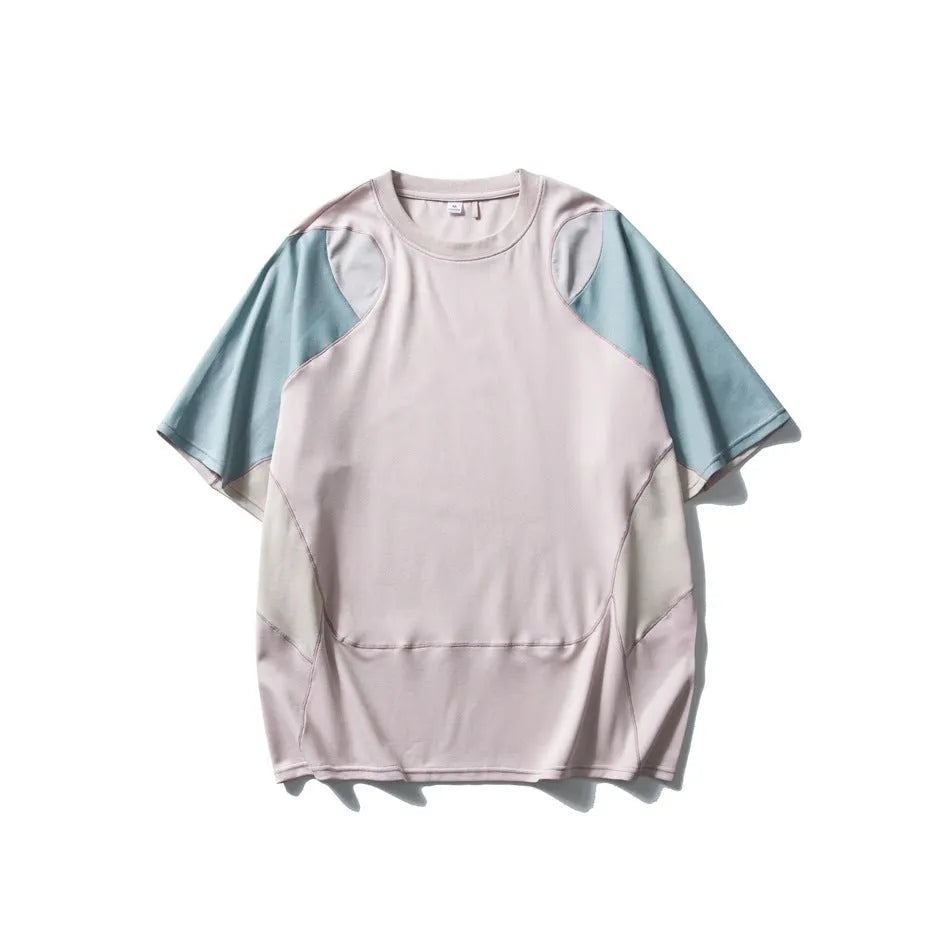 Man wearing a loose-fit patchwork contrast colour short sleeve cotton blend sports t-shirt.