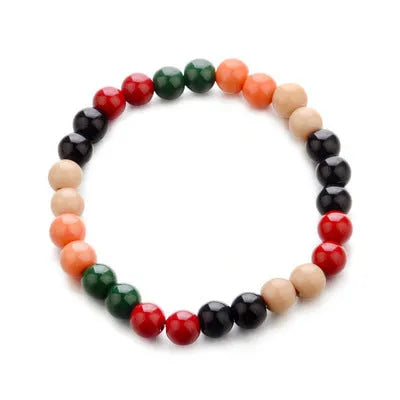 Unisex natural stone bead bracelet with lava stones for essential oils, ethnic style, on a wrist.