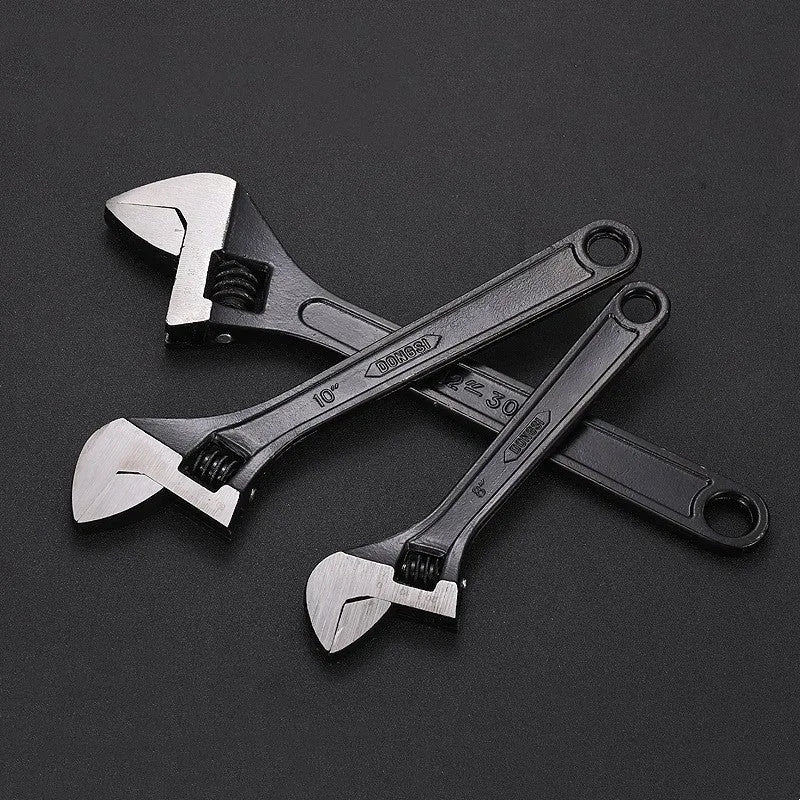 Stainless steel adjustable wrench with blackened finish showing adjustable jaw mechanism