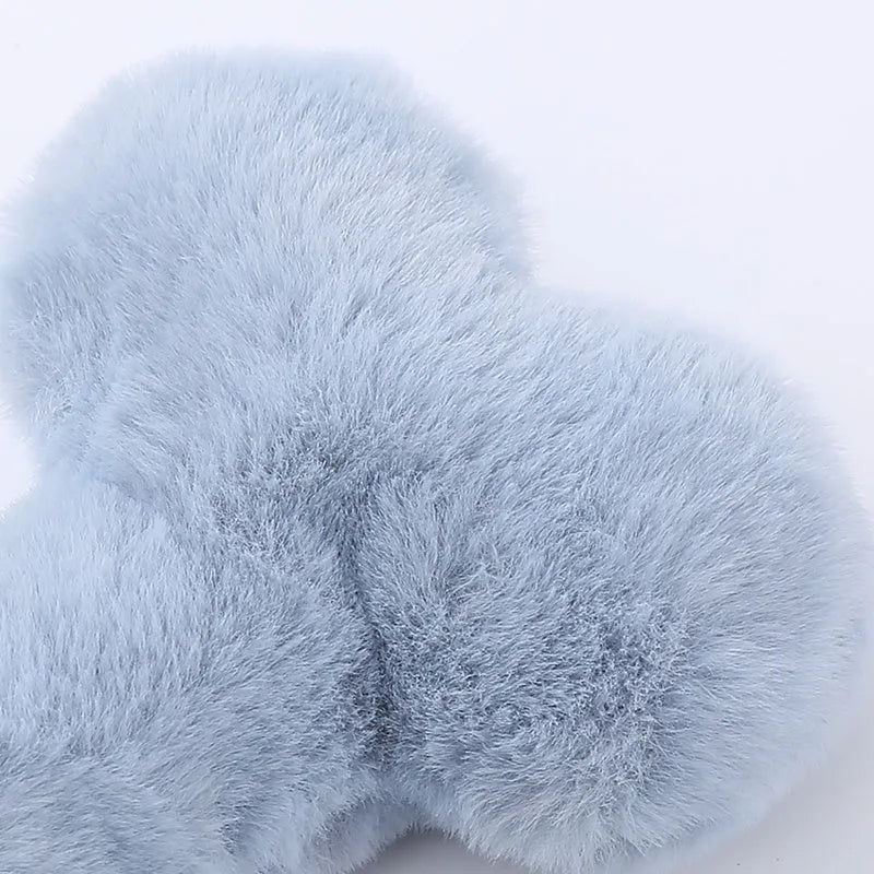 Blue, pink and yellow bone-shaped plush dog toys with squeaker for interactive play