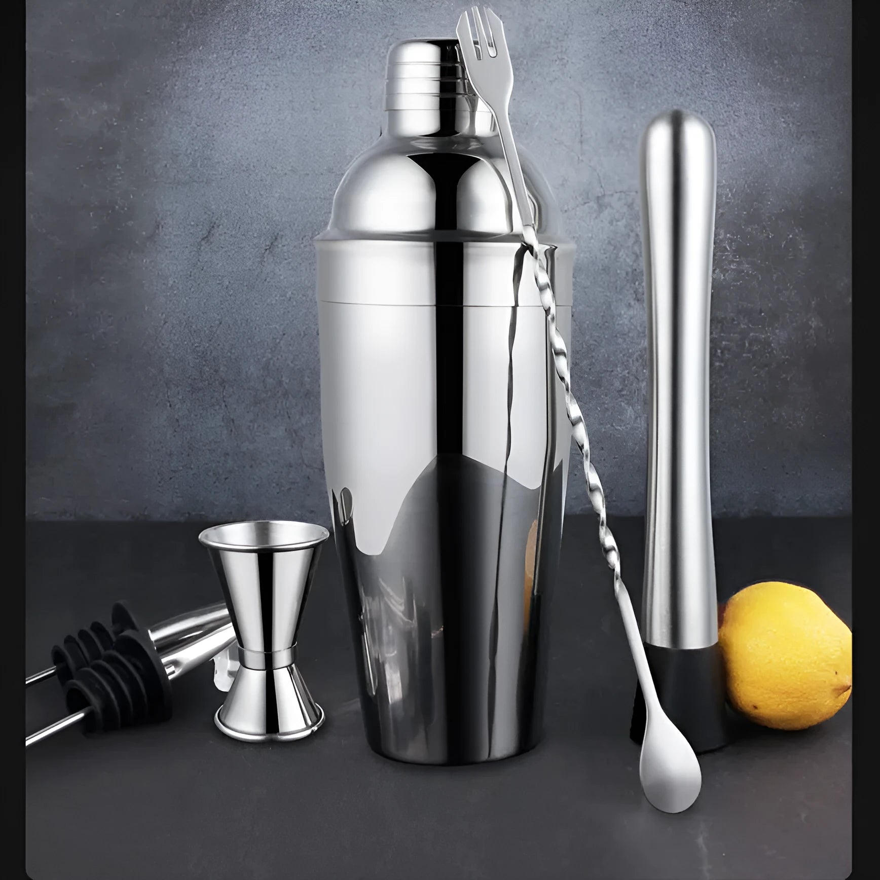 23-piece stainless steel cocktail bar set with acrylic European style mixers laid out on a table.