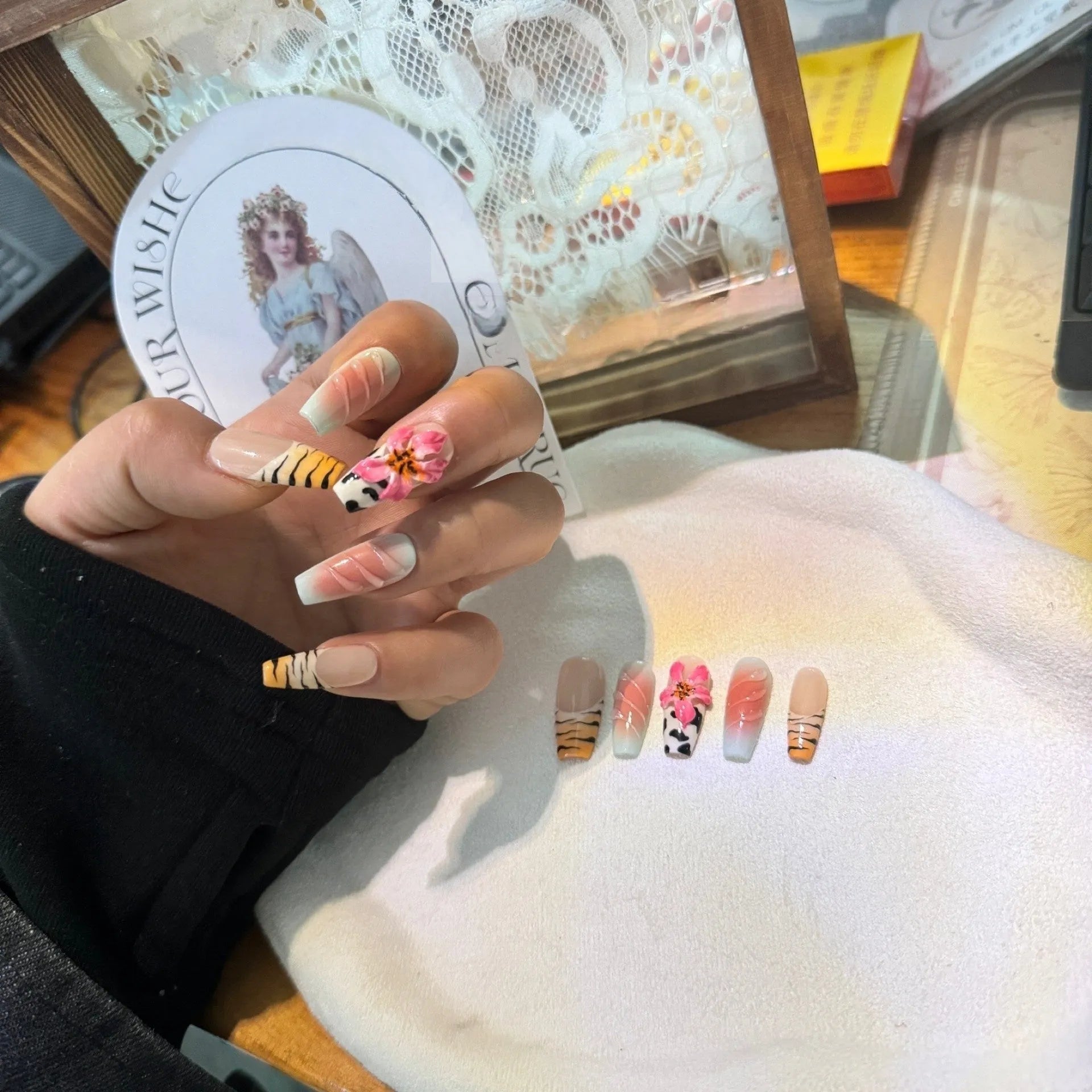 Zebra pattern lily hand carving nail art set showing embossed floral and leopard print designs