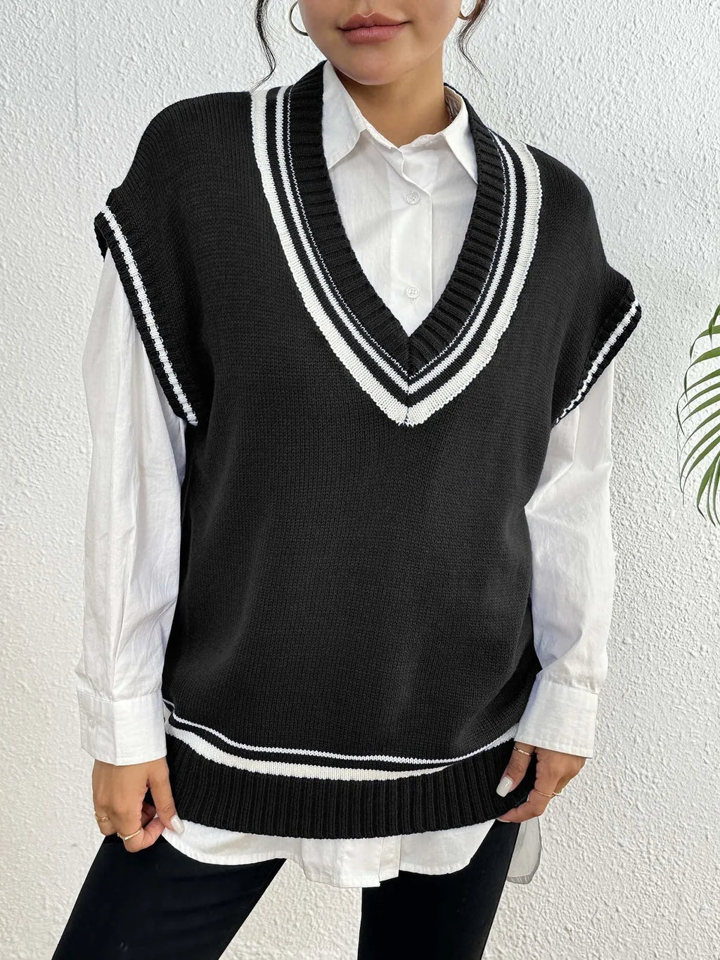 Women's loose-fit acrylic blend vest sweater in college style available in blue, coffee, and black colours