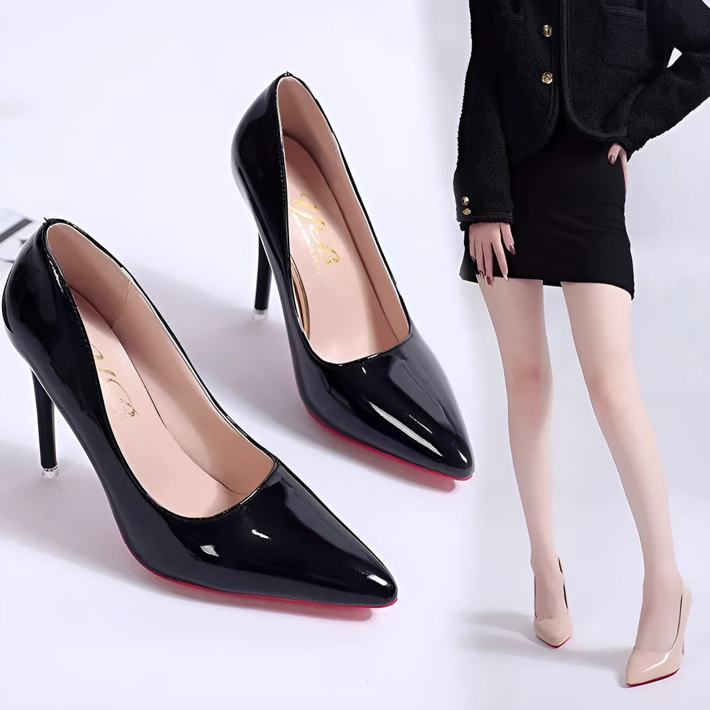Women's black pointed toe stiletto pump with a shallow mouth design on a rubber sole.