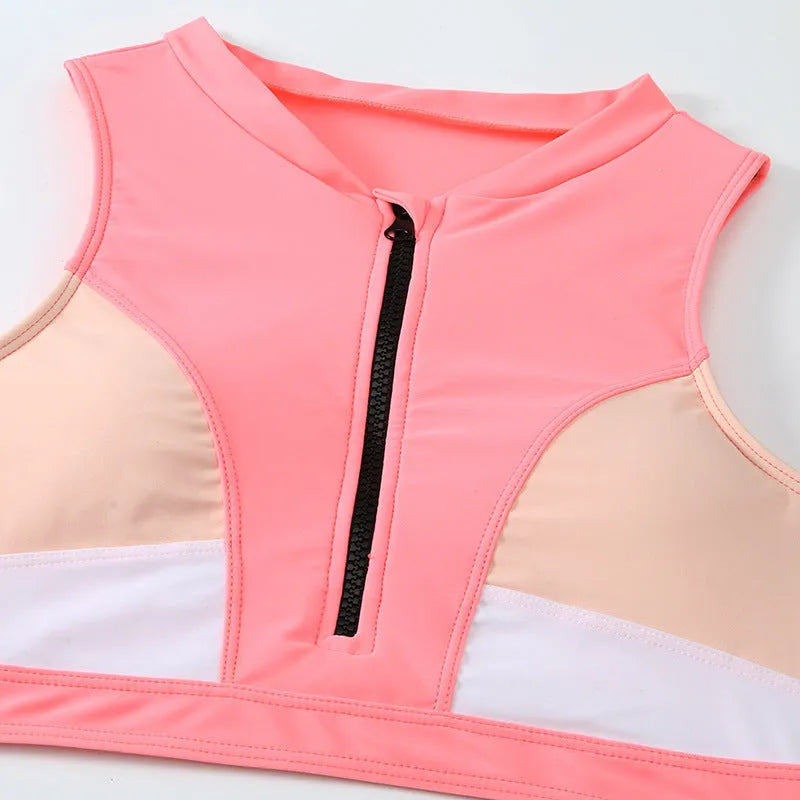 Pink high-waist split bikini swimsuit with sleeveless design and solid colour